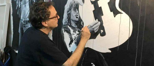 John Douglas creating a painting