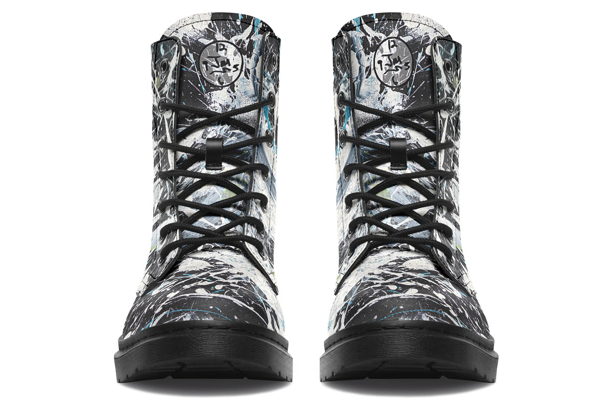Pair of high-top sneakers with a camouflage pattern on a white background