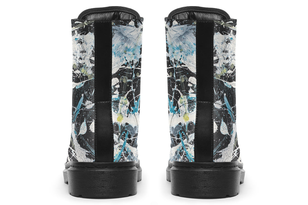 Pair of rain boots with abstract pattern on a white background