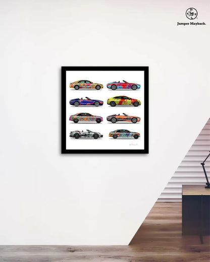 Stack of eight colorful car print artworks by Jumper Maybach on paper, arranged in an office vignette style.