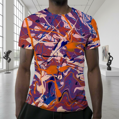 Person wearing a colorful abstract patterned t-shirt in an indoor setting.