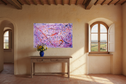 Room with a painting on the wall, a table with flowers, and a window overlooking a scenic view.