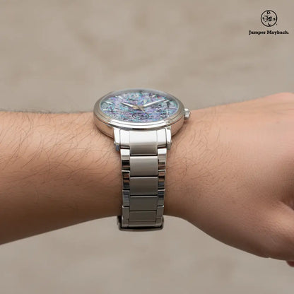 Side profile of Dream Dimension Steel Strap Automatic Watch by Jumper Maybach®, featuring a sleek stainless steel band and time indicators.