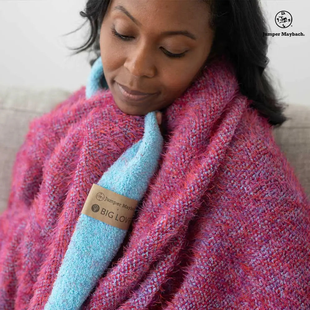 Big LOViE DREAM jumper blanket in cosmic cotton candy cherry with soft, plush fabric and vibrant pink and red colors.