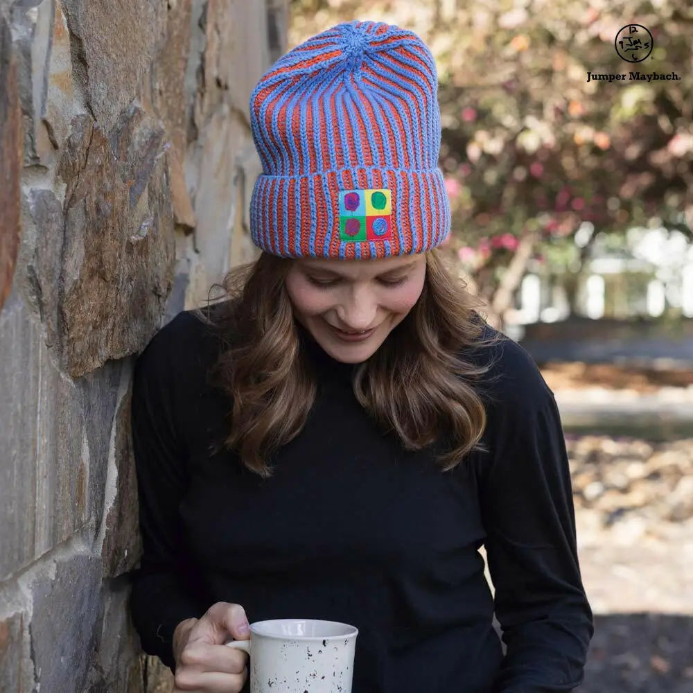 Big LOViE JM x BL Cosmic Color Contrast Hat in sea blue with vibrant tangerine accents, front view showing bold design.