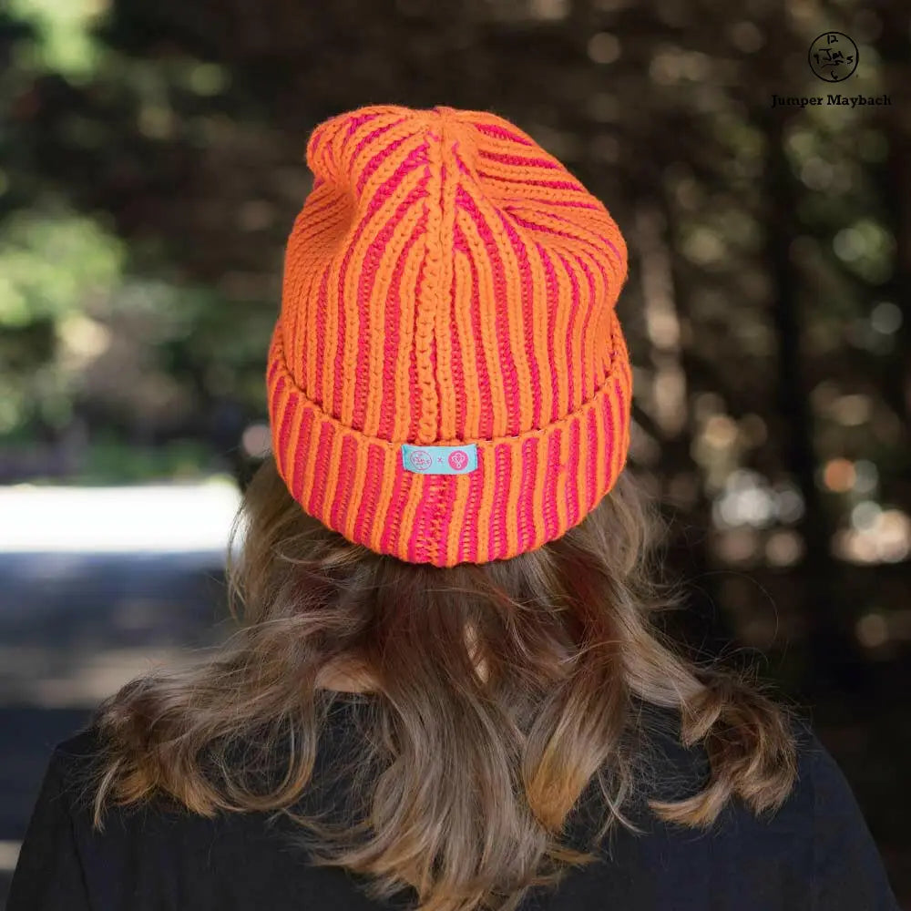 Big Lovie JM x BL Cosmic Color Contrast Hat in tangerine and fuchsia, showing the back view with bold color-block design.