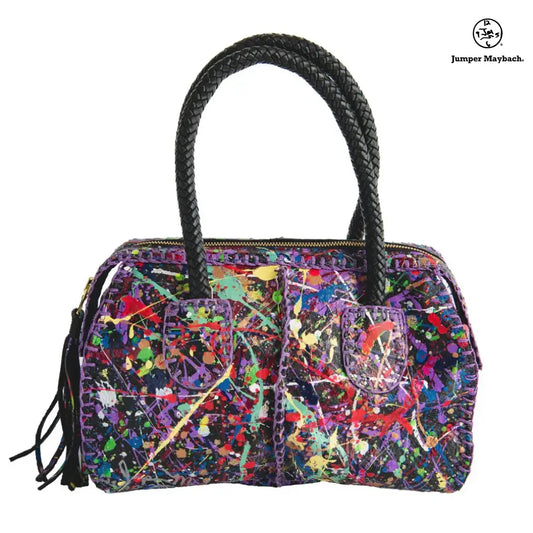 Carlos Falchi Jumper Maybach's Mini Barrel bag with leather strap and textured barrel design, shown in a detailed front view.
